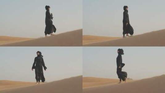 穆斯林女人在沙漠上行走高清在线视频素材下载