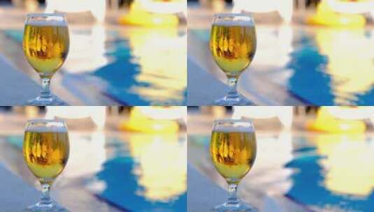 微距啤酒特写 海边泳池一杯啤酒冒泡啤酒高清在线视频素材下载