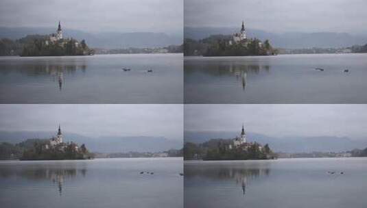 斯洛文尼亚朱利安阿尔卑斯山布莱德湖的彩色日出景观高清在线视频素材下载