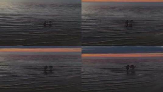 竖屏、傍晚黄昏情侣在海边奔跑高清在线视频素材下载