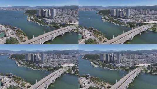 云南大理城市西洱河兴盛大桥航拍洱海高清在线视频素材下载