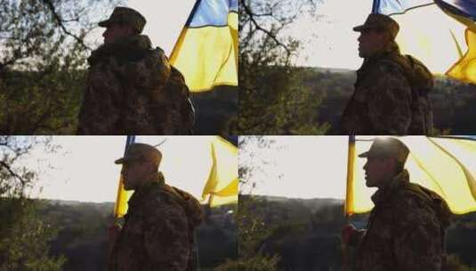 身着迷彩服的乌克兰陆军士兵举着蓝石旗帜站高清在线视频素材下载