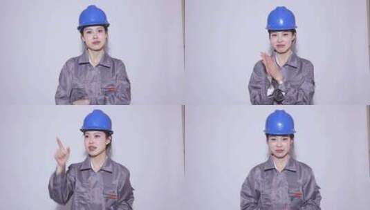 中国女孩戴蓝色安全帽工人服装做手势高清在线视频素材下载