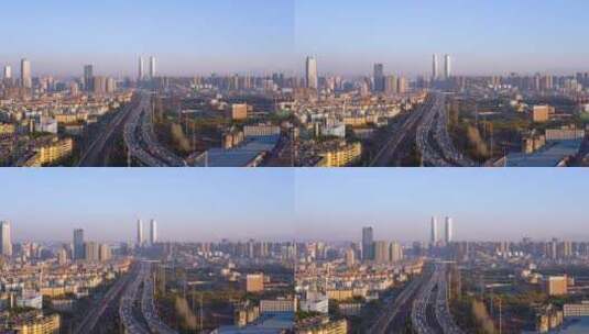 中国云南昆明双子塔和高架桥车流黄昏风光高清在线视频素材下载