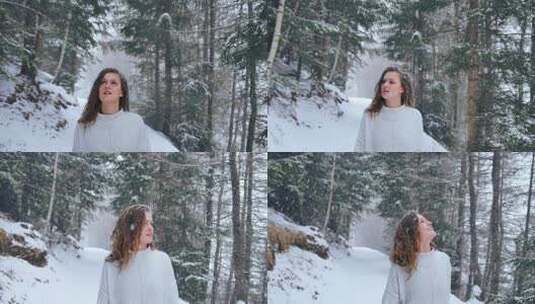 女人走路扔了一片白雪覆盖的森林，环顾四周美丽的风景高清在线视频素材下载