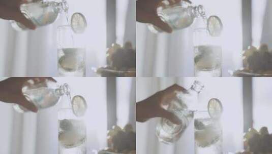 往装着冰块的玻璃杯里倒入气泡水高清在线视频素材下载