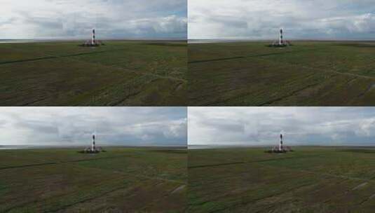 德国北弗里斯兰西海边灯塔的空中视差高清在线视频素材下载
