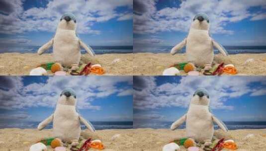 海滩上有垃圾的玩具企鹅高清在线视频素材下载