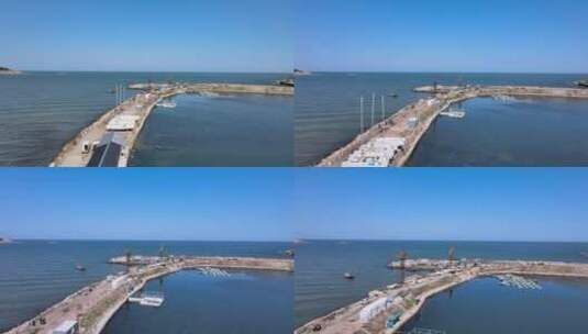 航拍威海金海滩海水浴场智明水产养殖码头高清在线视频素材下载