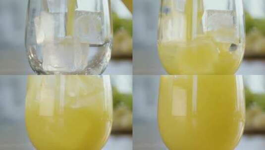 把橙汁倒在玻璃杯上高清在线视频素材下载