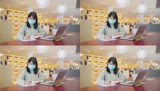 疫情带口罩年轻女子在咖啡店使用笔记本电脑高清在线视频素材下载