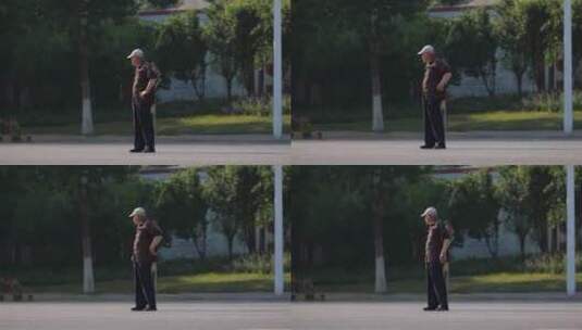 老人在马路上等车过马路高清在线视频素材下载