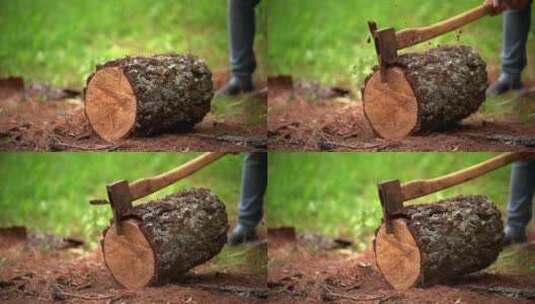 一名男子用斧头劈开一块木头高清在线视频素材下载
