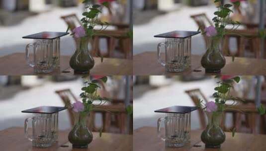 街边茶桌上的茶杯和桌花高清在线视频素材下载