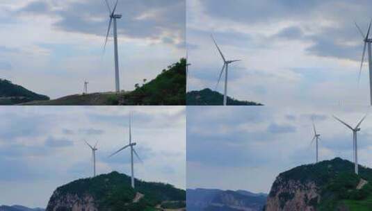 绿色的大山里的大风车高清在线视频素材下载