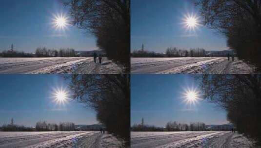 逆光拍摄人走在雪地上高清在线视频素材下载