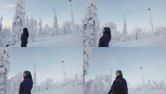 女孩下山观察美丽的白雪覆盖的冬季仙境在拉高清在线视频素材下载