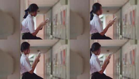 一个穿着白色制服的亚洲高中生女孩焦急地坐高清在线视频素材下载