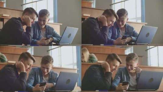 两个男人在教室里看手机高清在线视频素材下载