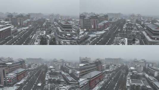 航拍陕西省西安市大雪中的西安钟楼街道风景高清在线视频素材下载