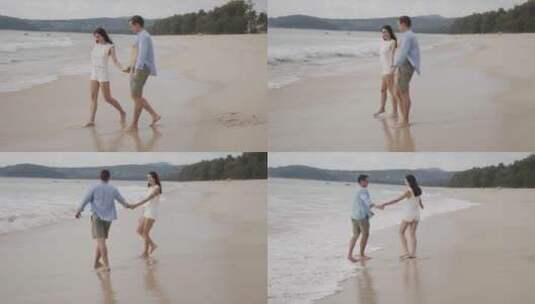 情侣在沙滩边散步高清在线视频素材下载