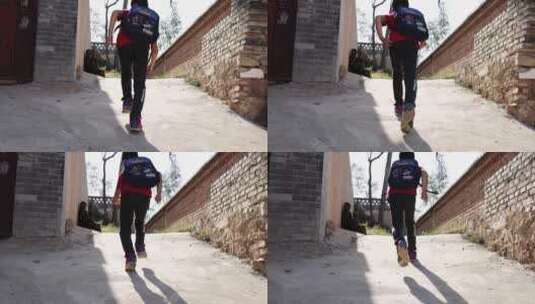 农村小学生放学背书包奔跑回家背影高清在线视频素材下载