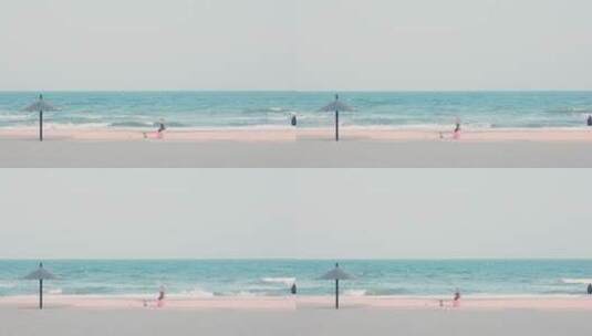8k实拍夏日海边沙滩上游玩的一家人高清在线视频素材下载