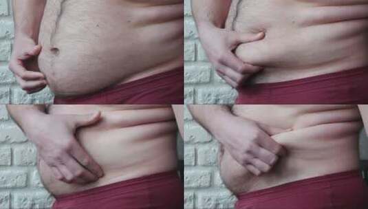 肥胖的男人。一个超重的男人在展示大肚子高清在线视频素材下载
