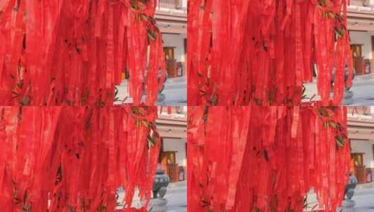 寺庙里在微风中飘动的红色祈福带高清在线视频素材下载