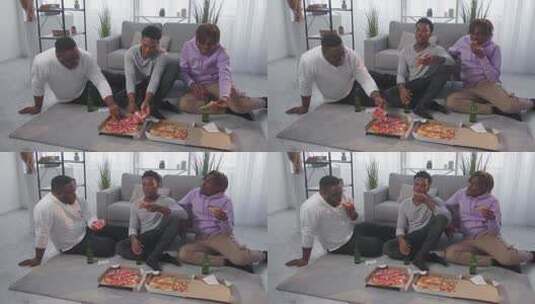 三个男子享受美味的比萨饼高清在线视频素材下载