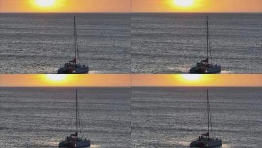 航拍小船海上看日落高清在线视频素材下载