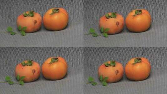 刚采摘下来的两只新鲜柿子高清在线视频素材下载