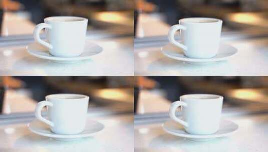 咖啡桌上热气腾腾的咖啡，白色杯子高清在线视频素材下载