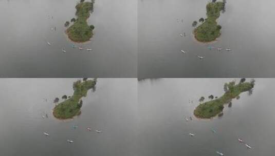 航拍阴天在庐山西海划桨板水上运动sup高清在线视频素材下载