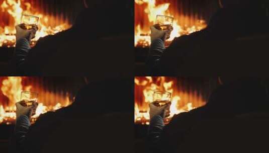 男人在火炉旁喝酒高清在线视频素材下载