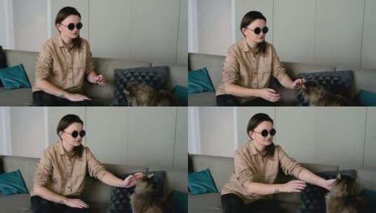 盲人女人逗宠物猫高清在线视频素材下载