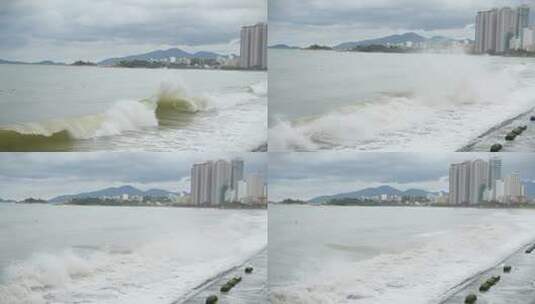 多云天气，下雨，大灰云，阴沉天气，海浪在城市岸边破裂高清在线视频素材下载