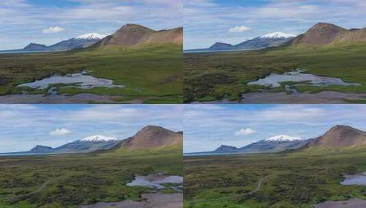 冰岛。山、田野和河流的鸟瞰图。冰岛白天的风景。高清在线视频素材下载
