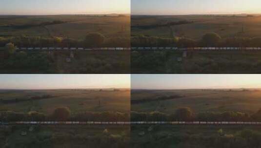 夕阳下行驶的货运火车高清在线视频素材下载