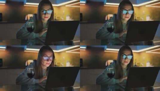女人晚上在笔记本电脑上工作高清在线视频素材下载