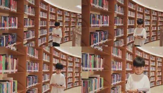 中国小男孩在图书馆看书阅读高清在线视频素材下载