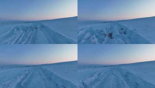大兴安岭丘陵山地冬季积雪覆盖的道路高清在线视频素材下载