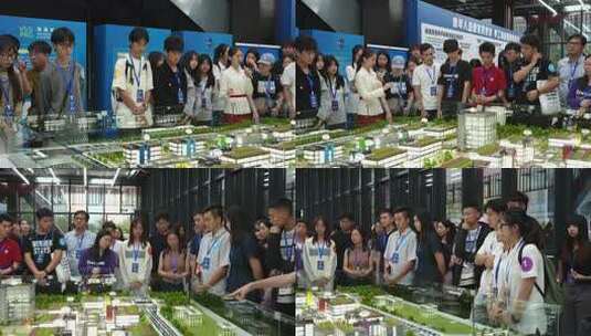 青年群体参观建筑模型讲解现场高清在线视频素材下载