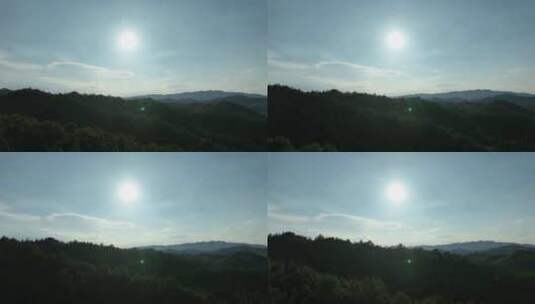 山峰阳光森林航拍山脉夕阳逆光天空太阳树林高清在线视频素材下载