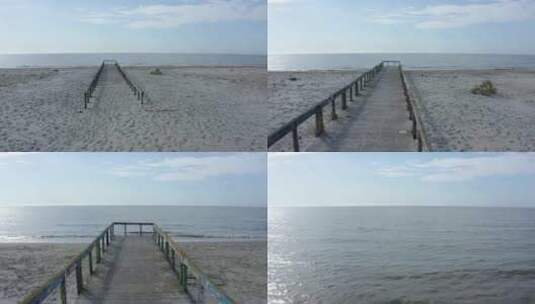 海滩上废弃的木制桥高清在线视频素材下载