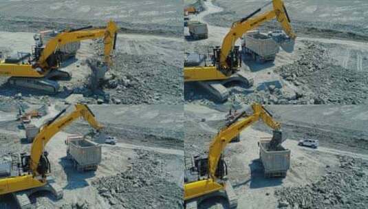 挖掘机将岩石装入卡车高清在线视频素材下载