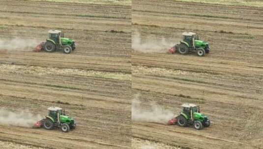 拖拉机在农田间工作高清在线视频素材下载
