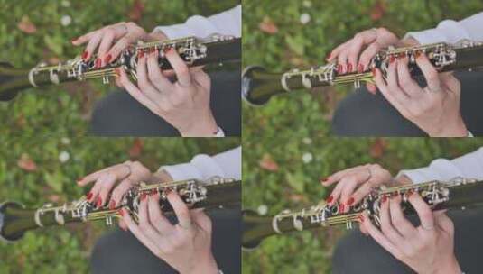 公园里吹单簧管的女孩高清在线视频素材下载