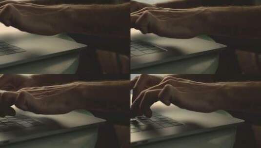 一个人的手在笔记本电脑上打字的特写镜头高清在线视频素材下载
