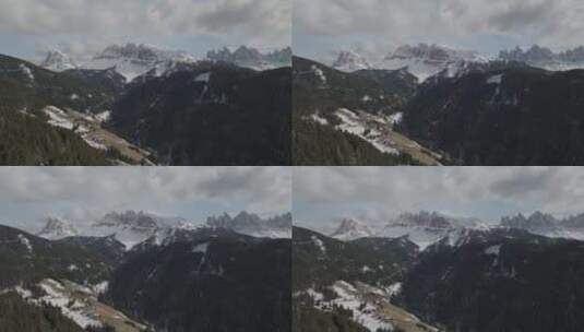 意大利南蒂罗尔雪山和森林地形的鸟瞰图。高清在线视频素材下载